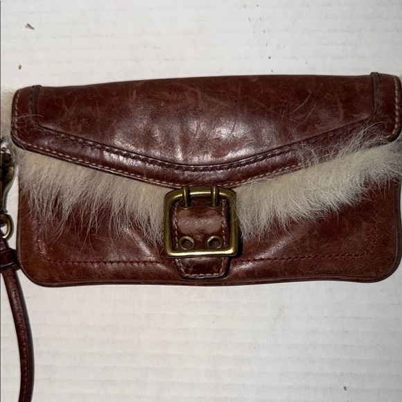 Coach Handbags - Coach Shearling Galaxy Chestnut Brown
Leather Buckle Wristlet Wallet